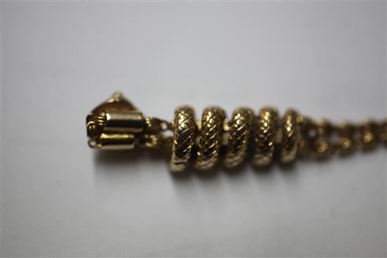 A late Victorian 9ct gold guard chain with gem set entwined serpent slide,